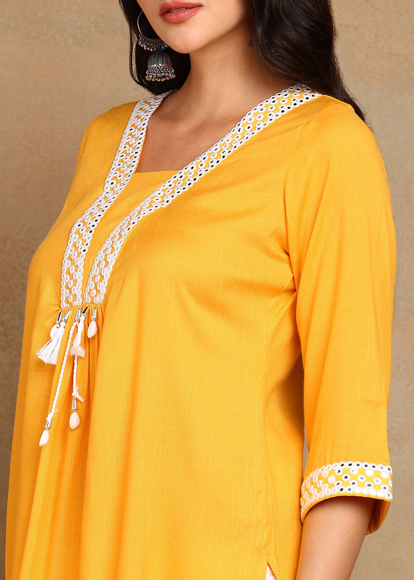 Mustard Rayon Slub Kurti with White Embroidered Lace Detailing